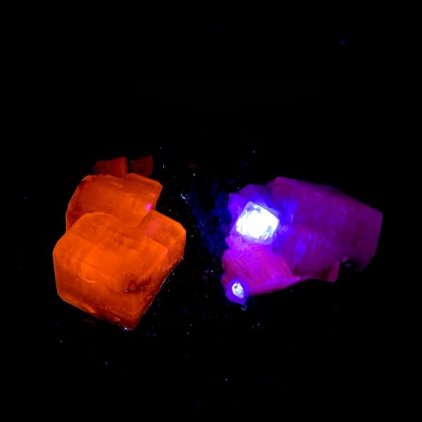 Star calcite crystals enclosing green fluorite on dark matrix from Fujian, China, second angle