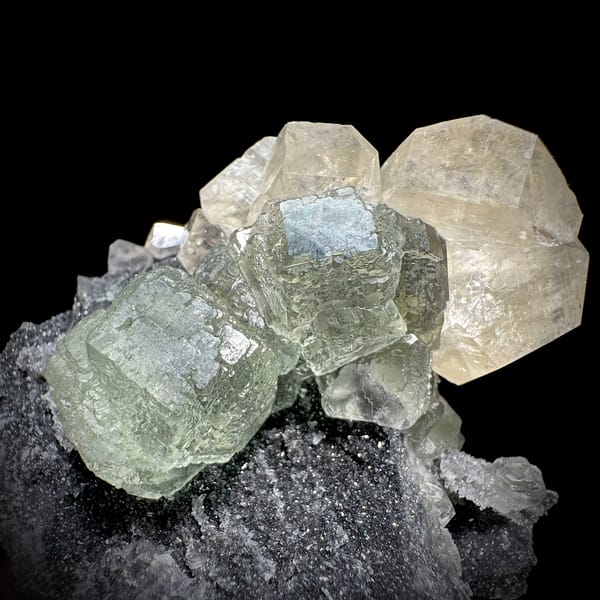 Pale green fluorite cubes with calcite on dark quartz from Fujian, China, reverse side