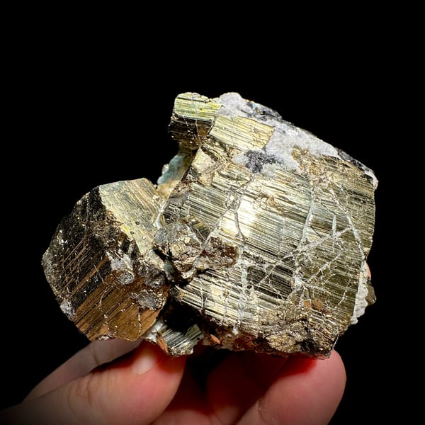 Heavy brass-gold pyrite block with striated faces and galena from Hunan, China, top view