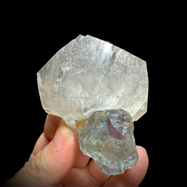 Large translucent star calcite with glassy blue-green fluorite from Fujian, China, close-up of the crystal faces