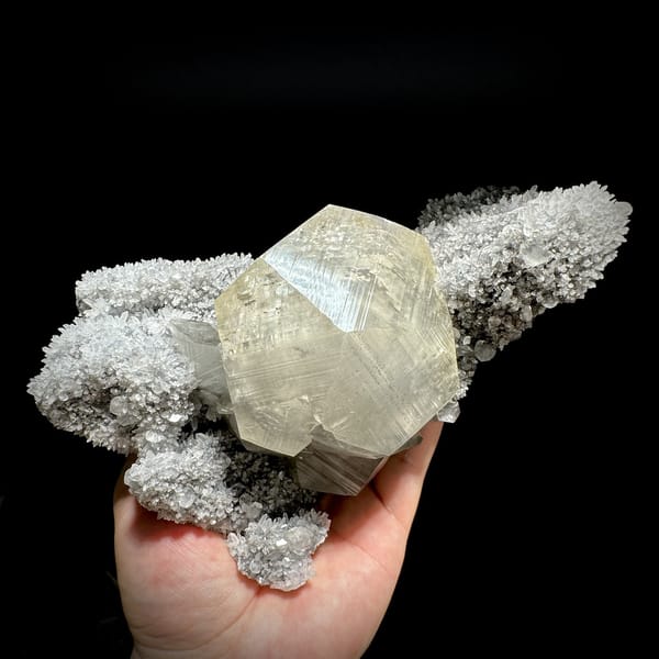 Giant star calcite crystal on long quartz-needle plate from Fujian, China, detail of the matrix contact