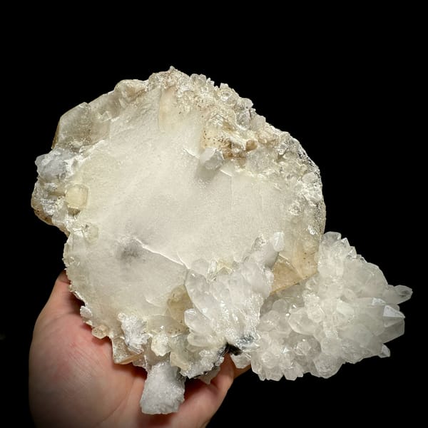 Huge tabular calcite plate over sparkling quartz from Fujian, China, reverse side