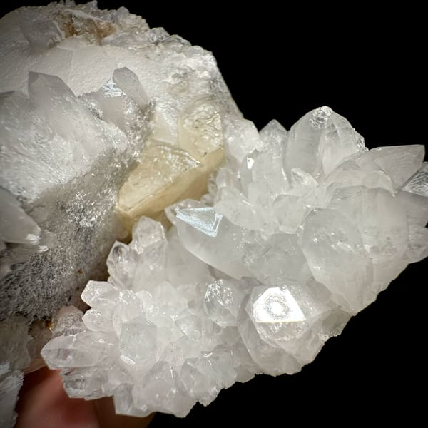 Huge tabular calcite plate over sparkling quartz from Fujian, China, top view