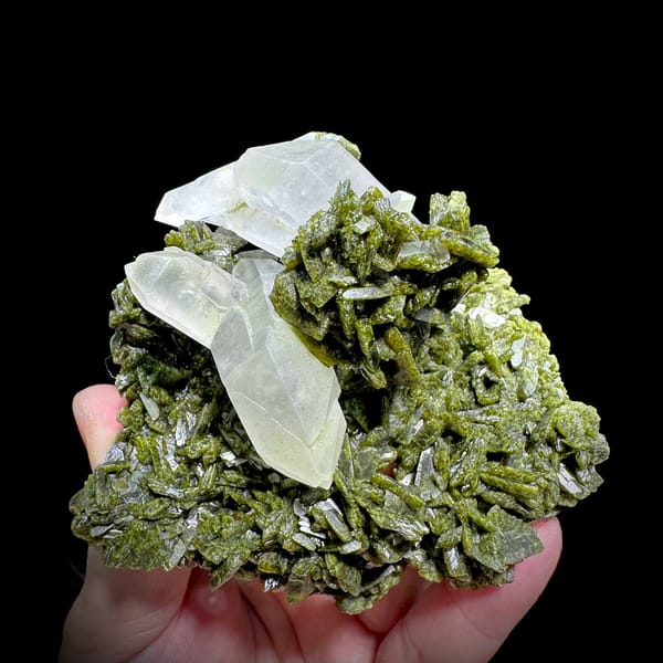 Clear double-terminated quartz nested in green epidote from Sichuan, China, top view