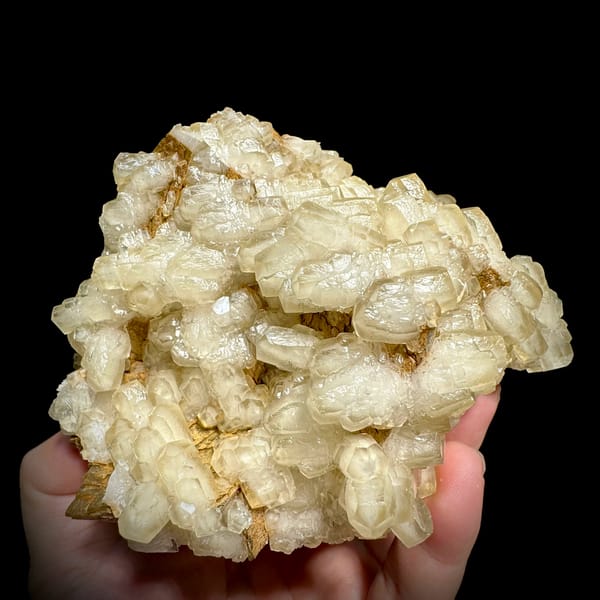 Mound of hammer-headed cream calcite crystals from Guizhou, China, reverse side