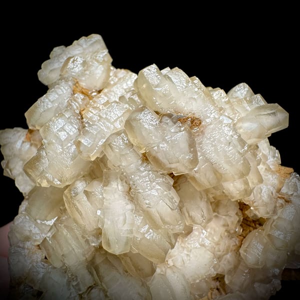 Mound of hammer-headed cream calcite crystals from Guizhou, China, top view