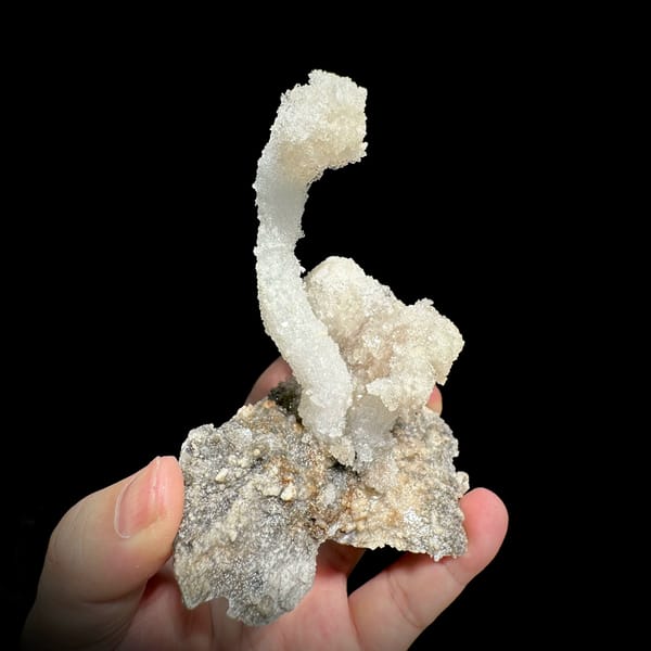 Curved white gypsum spire from Guizhou, China, close-up of the crystal faces