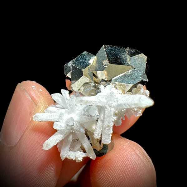 Gold pyrite crystal with clear quartz needle burst from Inner Mongolia, China, close-up of the crystal faces