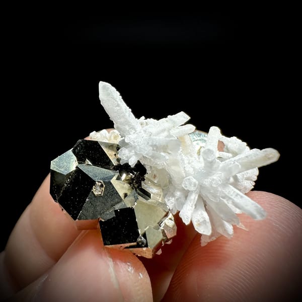 Gold pyrite crystal with clear quartz needle burst from Inner Mongolia, China, detail of the matrix contact