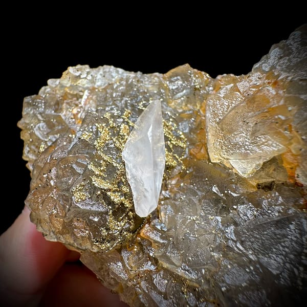 Glassy yellow fluorite with white calcite blade and pyrite from Xianghualing, Hunan, China, top view