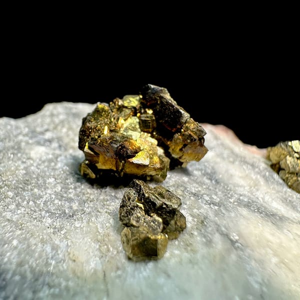 Brassy pyrite crystal clusters on pale sugary plate from Fujian, China, reverse side