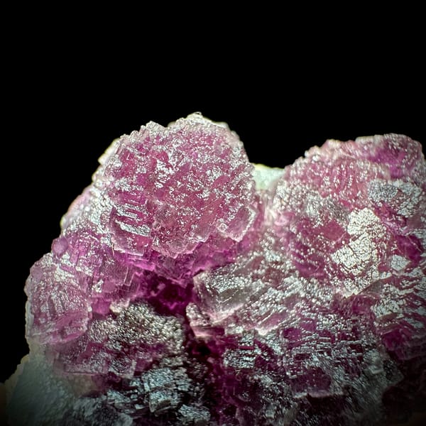 Raspberry-purple stepped fluorite crystals from Zhejiang, China, second angle