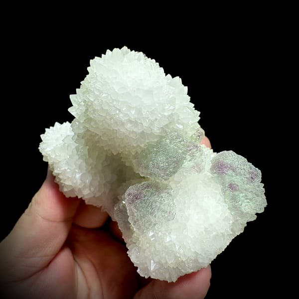 Purple-green fluorite balls beside white quartz needles from Fujian, China, second angle
