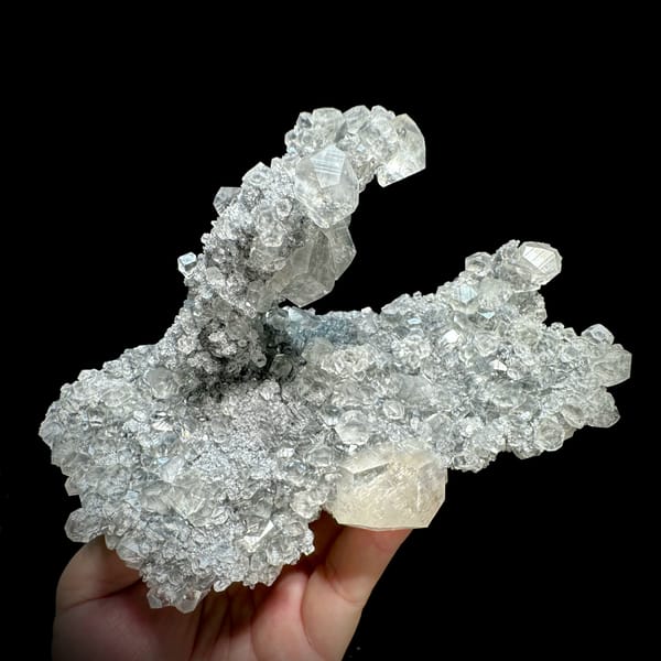 Branching frosted transparent calcite cluster from Fujian, China, close-up of the crystal faces