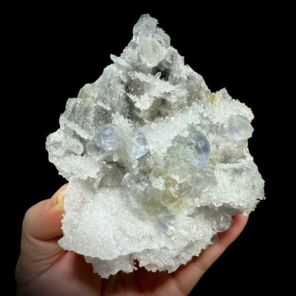 Blue-cored green fluorite among sparkling quartz and calcite from Fujian, China, top view