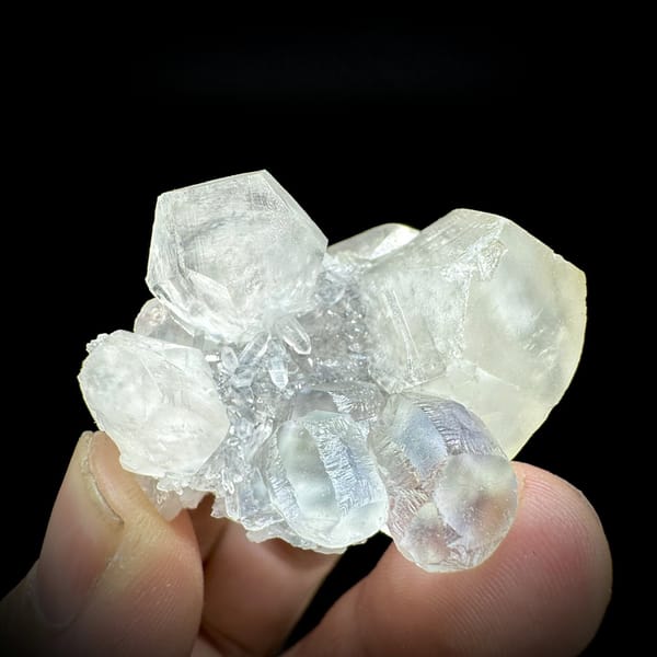 Glassy green fluorite with blue cores and milky calcite from Fujian, China, detail of the matrix contact