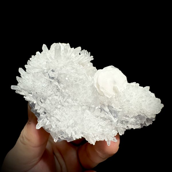 White quartz-needle cluster with platy calcite crystal from Fujian, China, close-up of the crystal faces