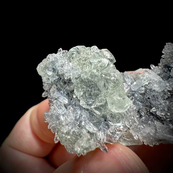 Pale green stepped fluorite on dark quartz druse from Fujian, China, reverse side
