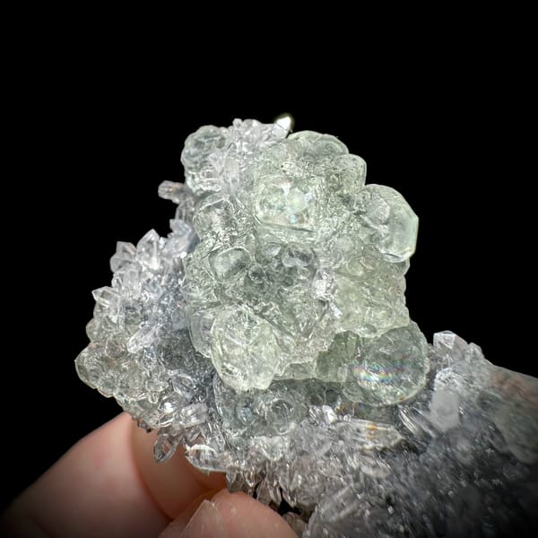 Pale green stepped fluorite on dark quartz druse from Fujian, China, top view
