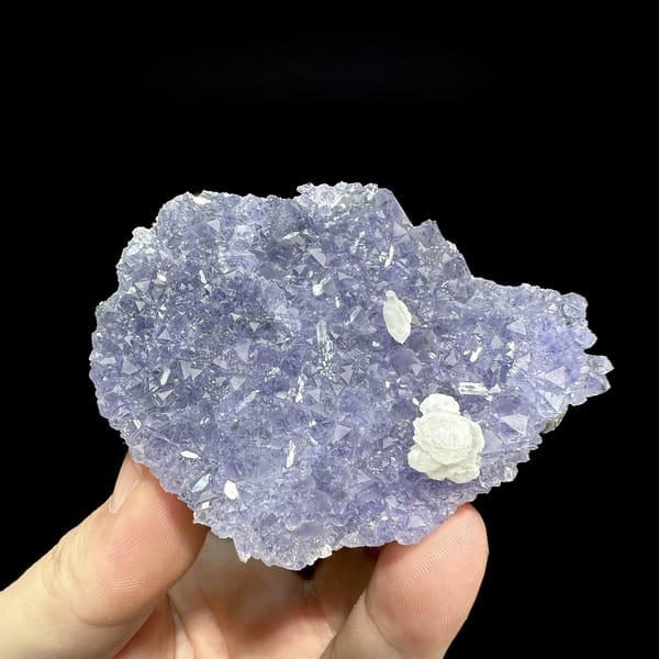 Lavender-blue fluorite plate with white calcite rosette from Fujian, China, detail of the matrix contact