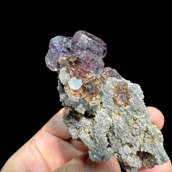 Lavender fluorite cubes on tall grey quartz stalk from Fujian, China, top view