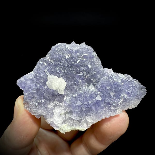 Lavender fluorite plate with white calcite rosette from Fujian, China, detail of the matrix contact