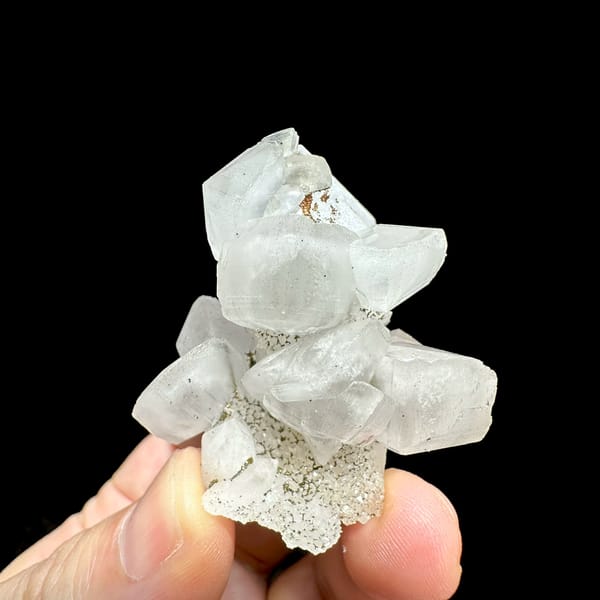 Stacked translucent calcite rhombs with pyrite from Fujian, China, top view