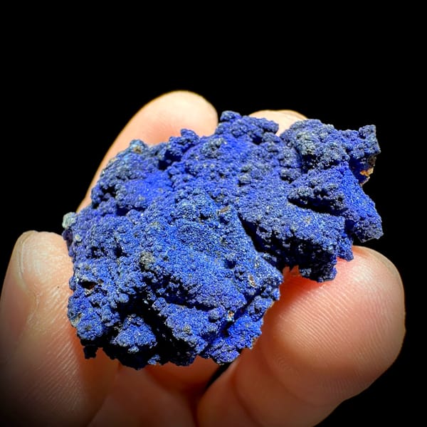 Royal-blue azurite crust covering fluorite from Yunnan, China, close-up of the crystal faces