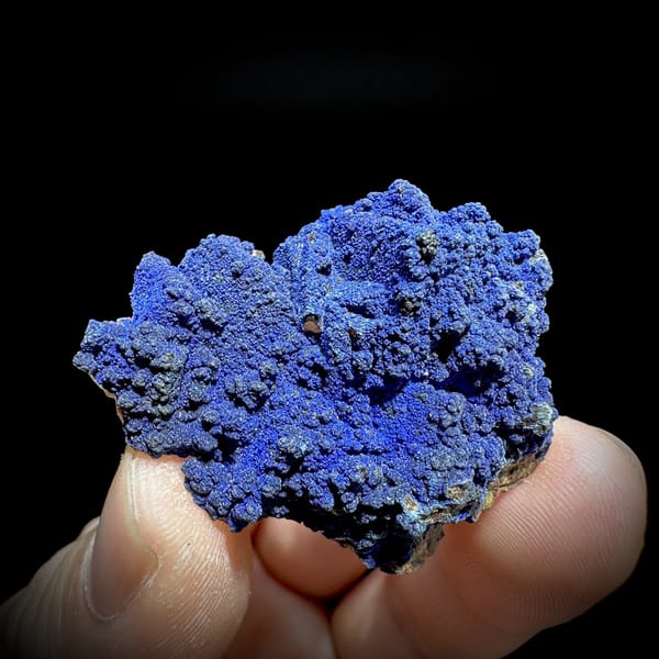 Royal-blue azurite crust covering fluorite from Yunnan, China, detail of the matrix contact