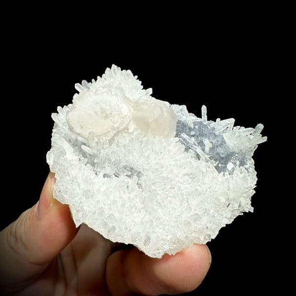 White quartz needles with calcite discs and pale blue fluorite from Fujian, China, close-up of the crystal faces