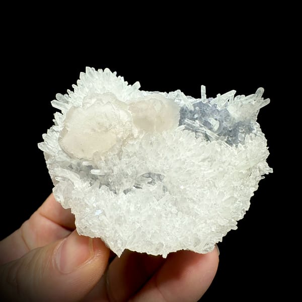 White quartz needles with calcite discs and pale blue fluorite from Fujian, China, top view