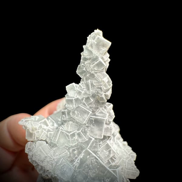 Sketch-patterned fluorite pillar of stacked cubes from Fujian, China, top view
