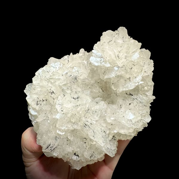 Rounded plate of flower-form calcite with limonite from Fujian, China, reverse side