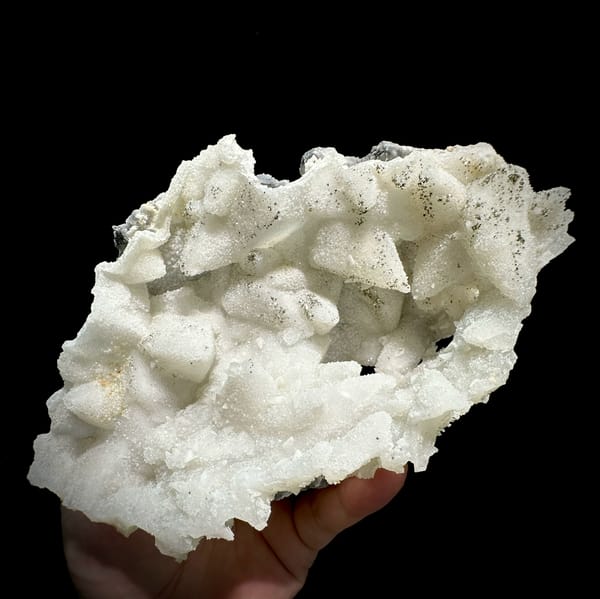 Cream quartz pseudomorphs after calcite with pyrite from Fujian, China, close-up of the crystal faces