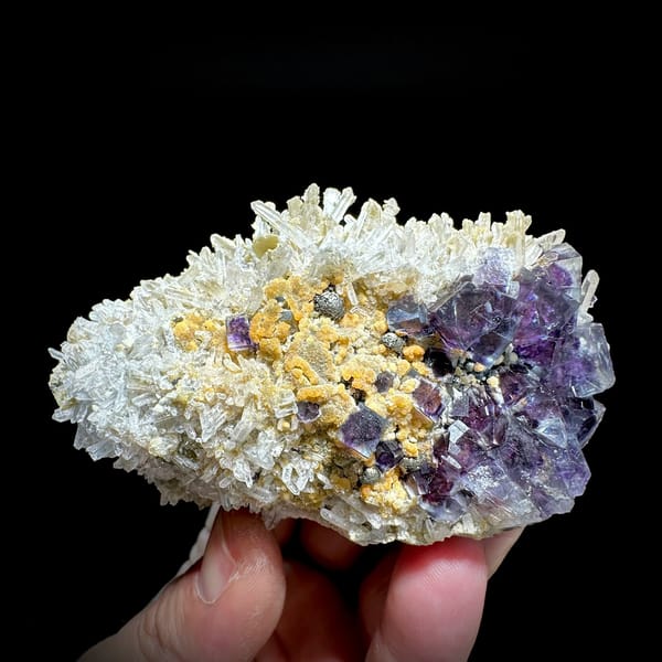 Purple phantom fluorite cubes in white quartz with siderite from Inner Mongolia, China