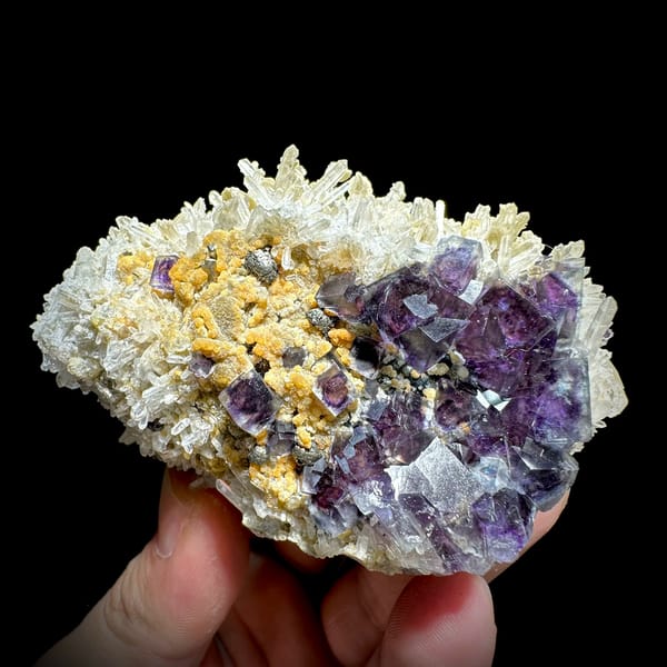 Purple phantom fluorite cubes in white quartz with siderite from Inner Mongolia, China, top view
