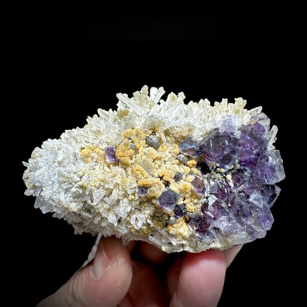 Purple phantom fluorite cubes in white quartz with siderite from Inner Mongolia, China, detail of the matrix contact
