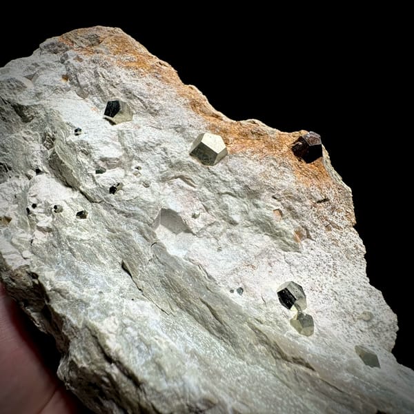 Small pyritohedral pyrite crystals on pale matrix block from Guangxi, China, top view