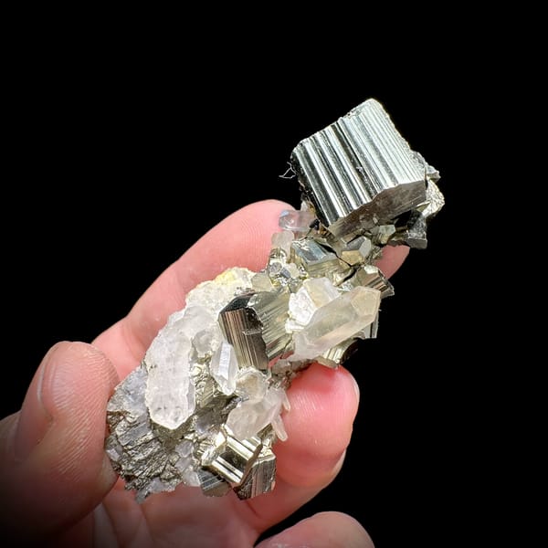 Striated pyrite cube on clear quartz and calcite from Indonesia, second angle