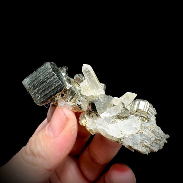 Striated pyrite cube on clear quartz and calcite from Indonesia, reverse side