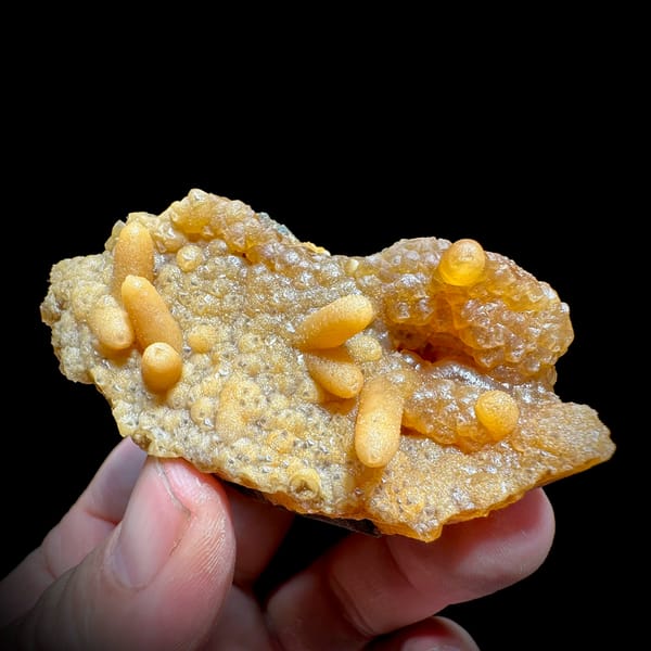 Orange caterpillar-form calcite over cream botryoidal plate from Yunxiao, Fujian, China, reverse side