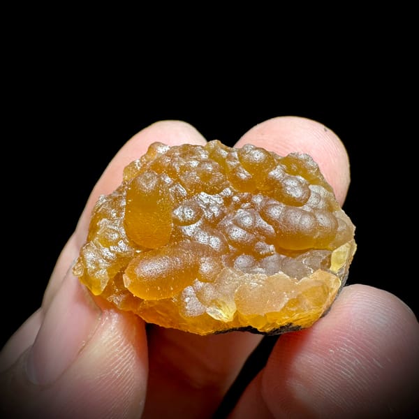 Tiny orange caterpillar-form calcite from Yunxiao, Fujian, China, reverse side