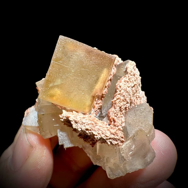 Honey-yellow fluorite cube on pink baryte and calcite from Beijing, China, second angle