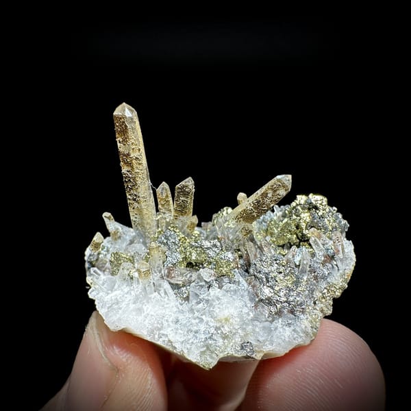 Clear quartz points with chalcopyrite and freibergite from Inner Mongolia, China, detail of the matrix contact