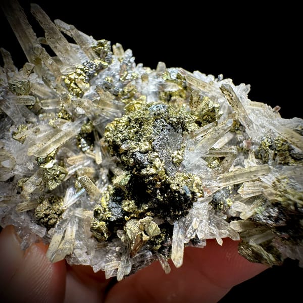 Clear quartz needles over chalcopyrite and freibergite from Inner Mongolia, China, close-up of the crystal faces