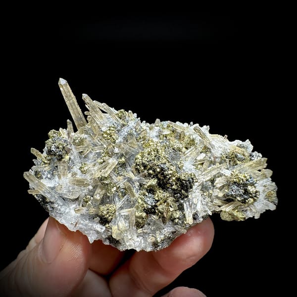 Clear quartz needles over chalcopyrite and freibergite from Inner Mongolia, China, detail of the matrix contact