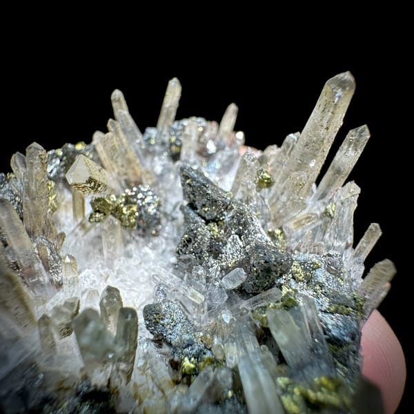 Clear quartz needles over chalcopyrite and freibergite from Inner Mongolia, China, close-up of the crystal faces
