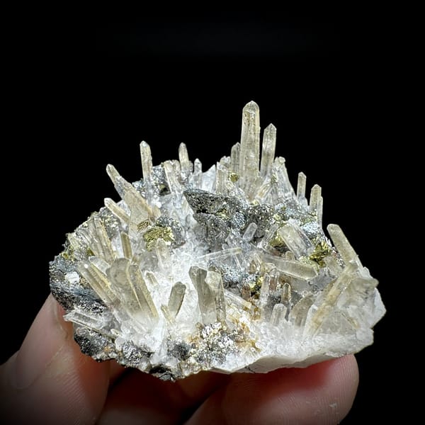 Clear quartz needles over chalcopyrite and freibergite from Inner Mongolia, China, detail of the matrix contact