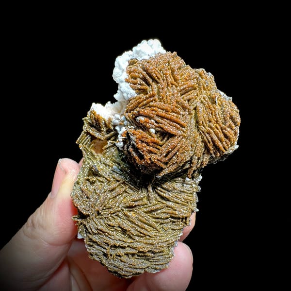 Sparkling brown vanadinite over bladed baryte from Morocco, close-up of the crystal faces