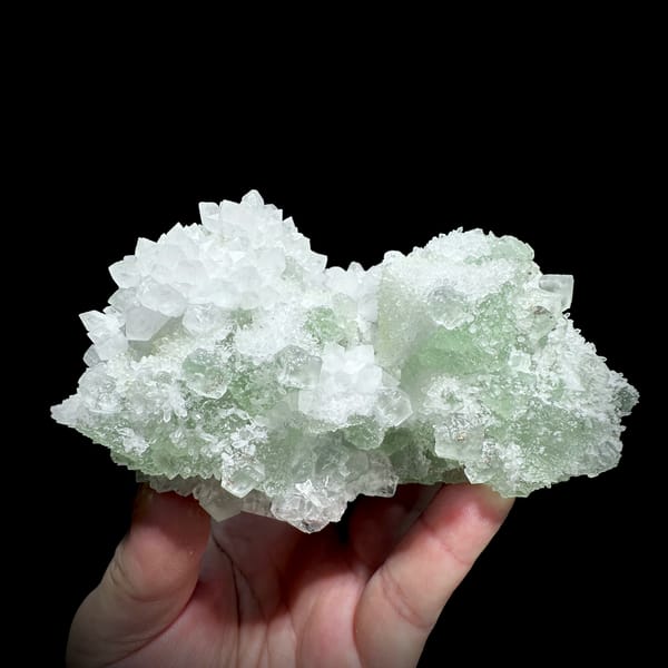 Stepped green fluorite octahedra in white quartz from Guangdong, China, close-up of the crystal faces